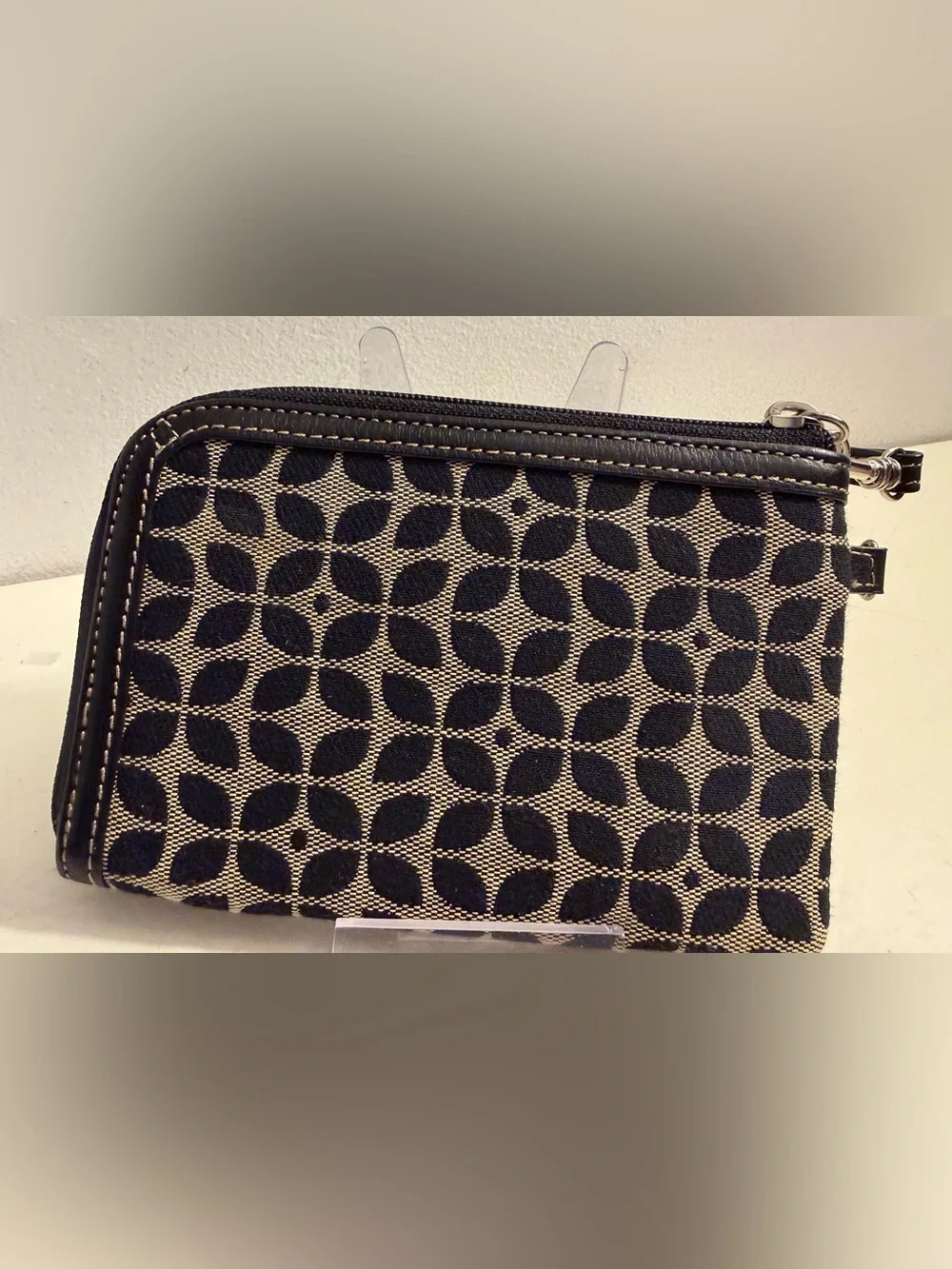 Fossil monogram canvas wristlet/wallet with leather trim.